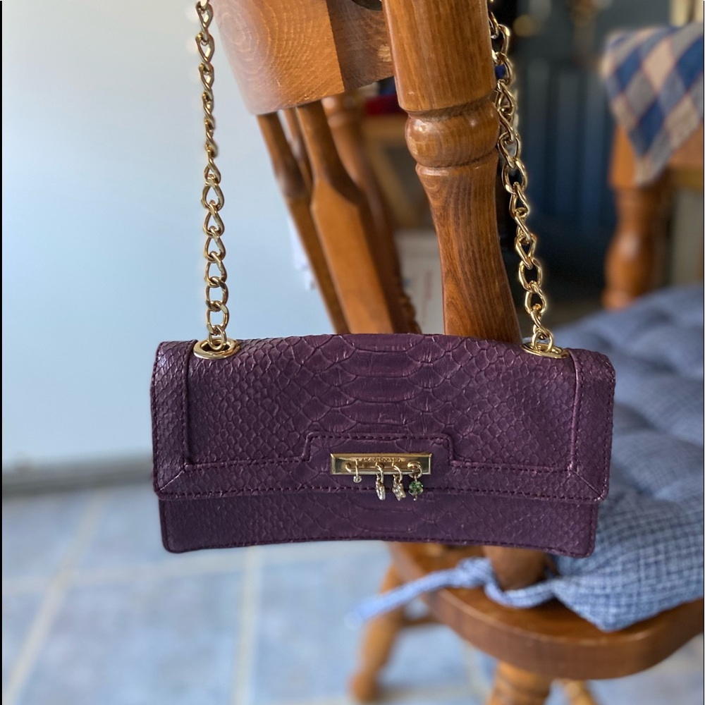 Liz Claiborne small purple faux crock skin purse with gold chain hardware.